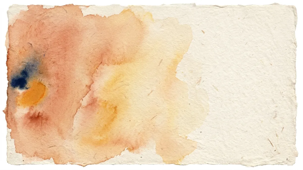Handmade paper with a faint red earth wash fading to cream